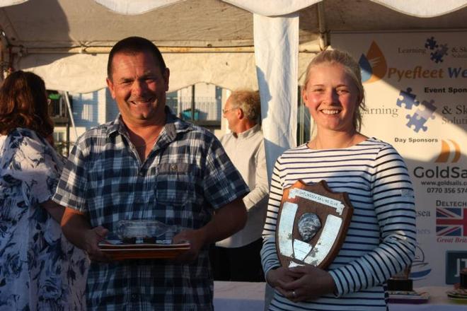 Andy and Sarah Bines with the Fast Handicap and Merlin Rocket Trophies – Learning and Skills Solutions Pyefleet Week ©  Mandy Bines